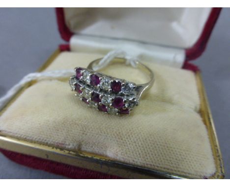 18ct White Gold Ring set with three rows of alternate nine rubies and ten diamonds