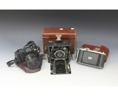 An Ihagee Duplex folding plate camera, cased, a Pentax P30 camera and a small collection of other cameras and accessories.