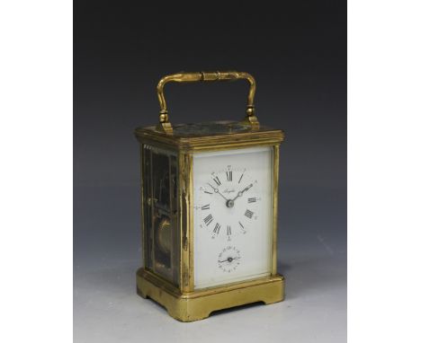 A 20th Century French lacquered brass carriage alarm clock with eight day movement repeating on a gong, the backplate with 'L