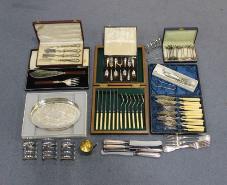 A George V silver four division toast rack, Sheffield 1933, a pair of silver claw ended sugar tongs, Birmingham 1934, and a c