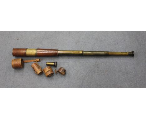 A First World War period leather mounted black enamelled brass three-draw telescope, inscribed 'T. T. & H. Ltd, 1918, No 3272