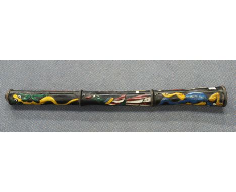 A 20th Century carved and painted didgeridoo, length approx 124cm.