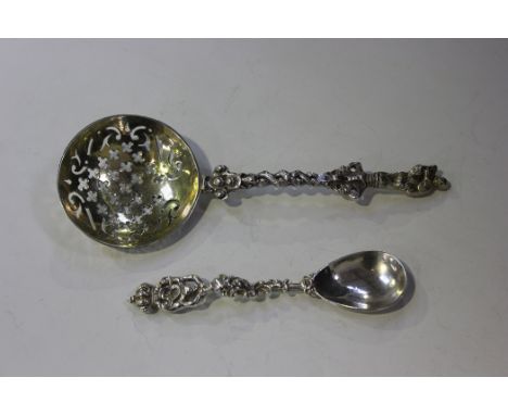 A Victorian silver baroque style sucrier spoon with pierced gilt bowl and figural finial, London 1846 by Charles Thomas Fox &