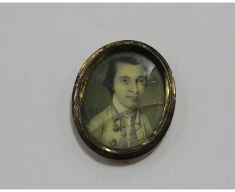 18th Century British School - Oval Miniature Portrait of a Gentleman, watercolour on ivory, approx 3cm x 2.5cm, within a gilt