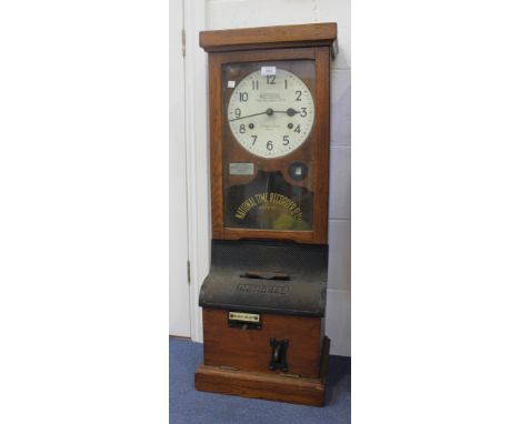 A National Time Recorder Co Ltd clocking-in clock, the singed painted circular dial with Arabic numerals and inscribed 'St. M