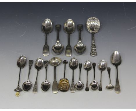 A Victorian silver caddy spoon with scallop shell bowl, the tapering handle decorated in relief with a classical scene of thr