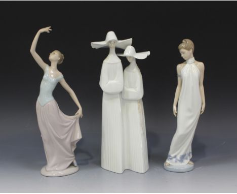 A Lladro porcelain figure group of two Nuns, No, 4611, together with two Nao figures, comprising Dance is Over, No 1204, and 