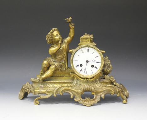 A late 19th Century French ormolu mantel clock with eight day movement striking on a bell, the circular enamel dial with blac