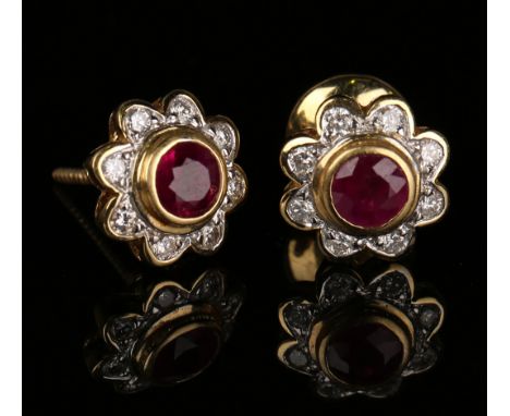 A pair of gold, synthetic ruby and diamond cluster earstuds, each mounted with a circular cut synthetic ruby within a surroun
