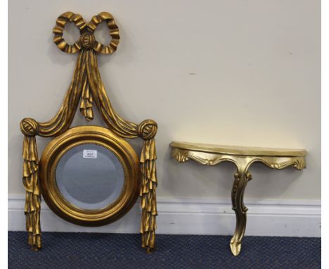 A modern gilt framed wall mirror, the circular bevelled plate within a cloth drape effect surround, approx 70cm x 39cm, toget