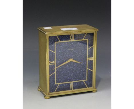 A Jaeger-LeCoultre gilt metal cased mantel timepiece with eight day movement, the lapis lazuli effect rectangular dial with s