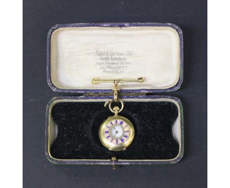 An 18ct gold and enamelled keyless wind half-hunting cased lady's fob watch, the white enamel dial with Roman numerals, the c