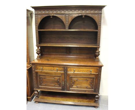 A George V oak dresser, the shelf back above two drawers and a pair of cupboard doors, on turned supports, height approx 200c