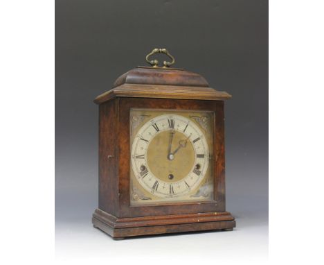 An early 20th Century Elliott mahogany cased mantel clock with eight day chiming movement, the square brass dial and silvered