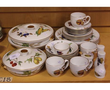 A Royal Worcester 'Evesham' pattern part service, comprising two graduated tureens and covers, serving dish, four dinner and 