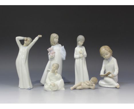 A group of six Nao porcelain figures, comprising Boy Reading Book, No 568, Sweet Dreams, No 1571, Girl Yawning, No 561, Girl 