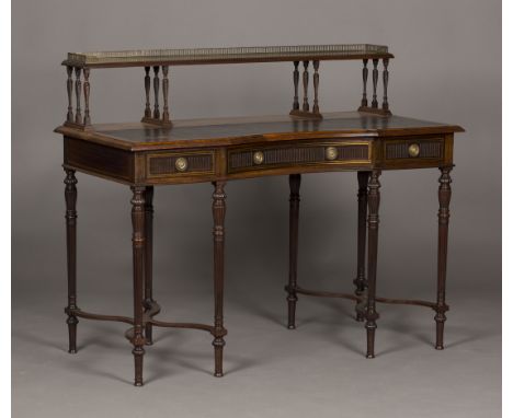 A late Victorian rosewood writing desk by Collinson & Lock, with overall inlaid brass line borders and fluting, the shelf bac