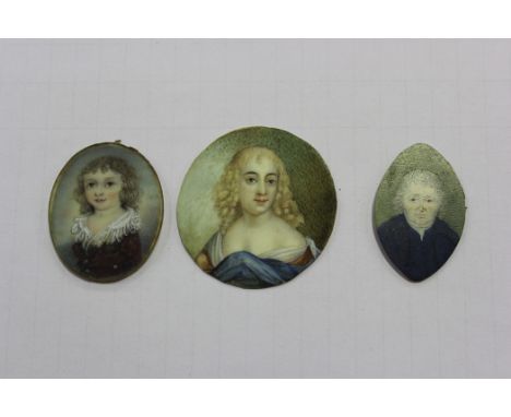 19th Century Provincial School - Oval Miniature Portrait of a Child, watercolour on ivory, approx 4cm x 3.5cm, together with 