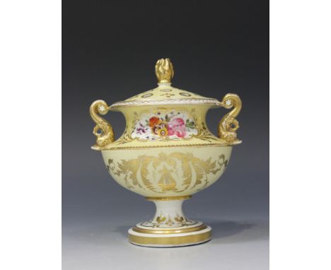 A Staffordshire porcelain potpourri vase and cover, circa 1830, the pierced cover with gilt flame finial, the urn shaped body