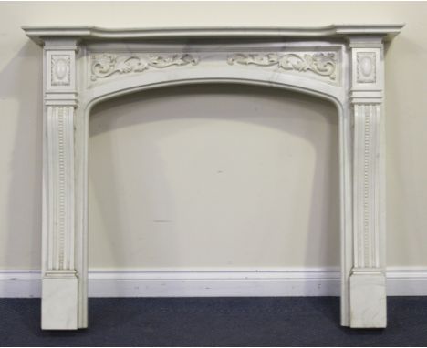 A modern moulded composite faux marble fire surround with foliate scroll frieze and beaded supports, height approx 109cm, wid