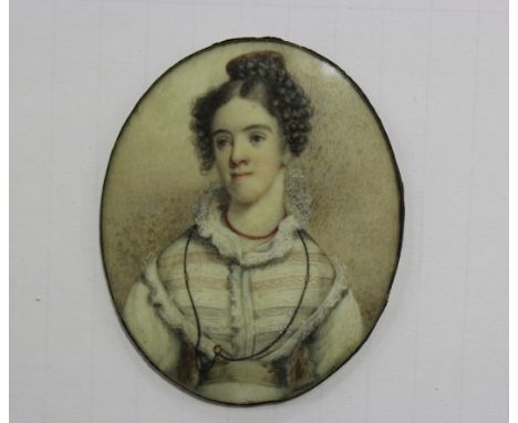 Mid-19th Century British School - Oval Miniature Portrait of a Lady wearing a Coral Necklace, approx 6cm x 5cm.