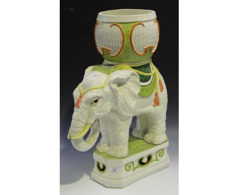A late 20th Century Italian ceramic jardinière stand in the form of an elephant standing on a pedestal, height approx 70cm.