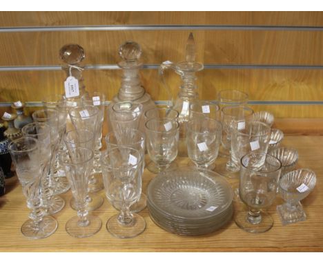 A pair of cut glass triple ring neck decanters and stoppers, early 19th Century, each with slice cut base, height approx 27cm