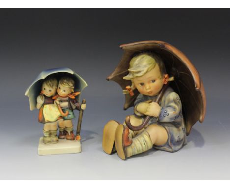 A Goebel Hummel figure of Umbrella Girl, modelled as a seated girl holding an open umbrella over one shoulder, height approx 