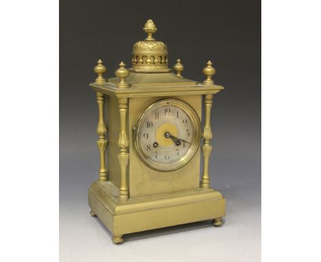 A late 19th Century gilt metal mantel clock with eight day movement striking on a gong, the dial with silvered chapter ring a