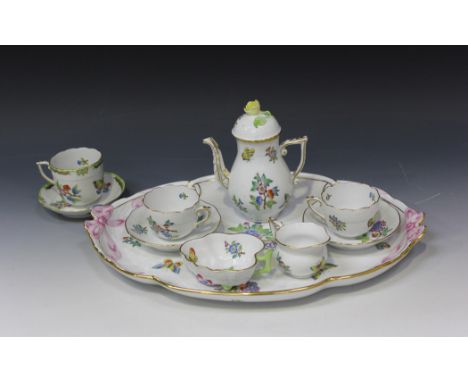 A Herend porcelain part cabaret set, 20th Century, decorated with sprays of flowers and butterflies within a moulded basket w