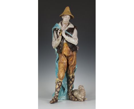 A Eugenio Pattarino pottery figure of a shepherd, modelled standing wearing a yellow hat, brown waistcoat and mustard breeche
