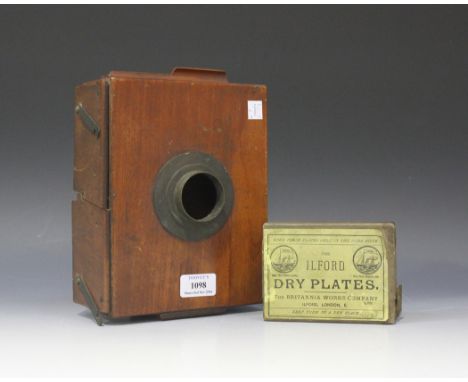 A late 19th Century mahogany plate camera and a box of Ilford dry plates.