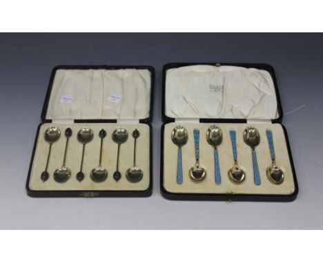 A set of six George V silver gilt and enamel bean end coffee spoons, each scalloped bowl back enamelled in a different colour