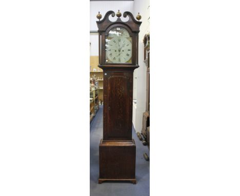 An early 19th Century Scottish oak longcase clock with eight day movement striking on a bell, the painted break arch dial wit