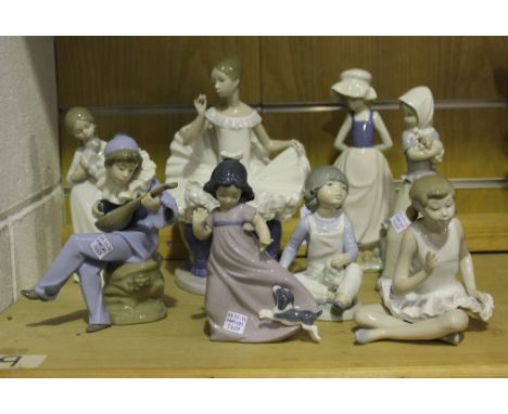 A group of eight Nao porcelain figures, comprising Tribute to a Ballerina, No 378, Attentive Ballet, No 146, Strumming, No 10