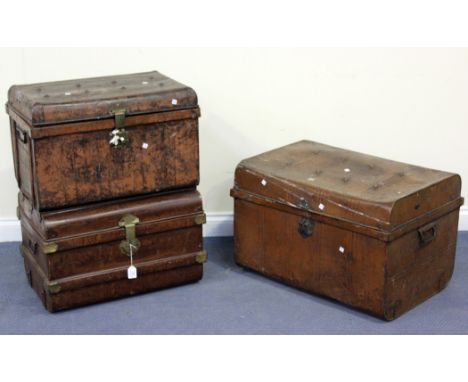 A late 19th Century tole painted faux walnut tin travelling trunk, width approx 66cm, together with two similar trunks.