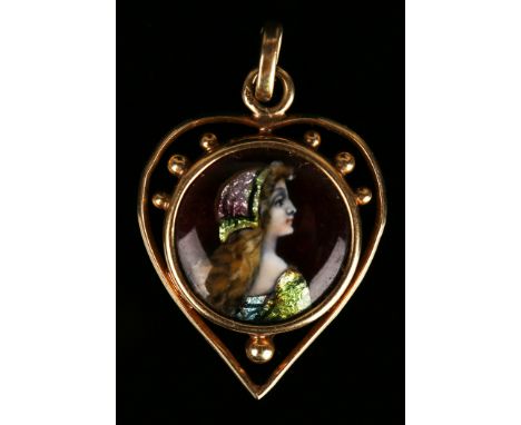 An early 20th Century gold mounted Limoges enamelled pendant, the circular Limoges panel decorated with a head and shoulders 