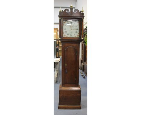 A George III oak longcase clock with thirty hour movement striking on a bell, the square painted dial with Roman numerals and