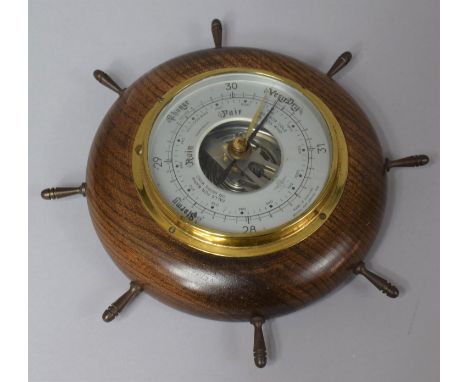 A Mid 20th Century Oak Cased Brass Mounted Ships Aneroid Barometer by Shortland, 23cm diameter 