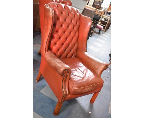 A Mid 20th Century Button Upholstered Red Leather Wing Armchair, In Need of attention 