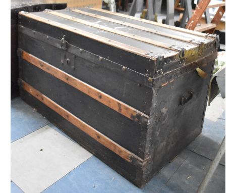 A Late 19th Century/Early 20th Century Wooden Banded and Brass Studded Travelling Trunk with Two Carrying Handles, Hinged Lid