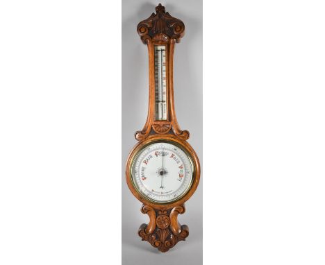 A Late Victorian/Edwardian Oak Cased Onion Topped Aneroid Barometer with Carved Decoration, 84cm high 
