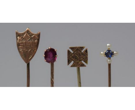 A Collection of Four Stick Pins to Include Two Jewelled Gold Examples 