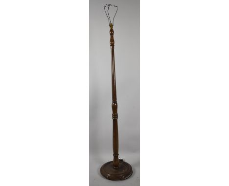 A Mid 20th Century Turned Wooden Standard Lamp On Circular Base 