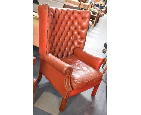 A Mid 20th Century Button Upholstered Red Leather Wing Armchair, In Need of attention 