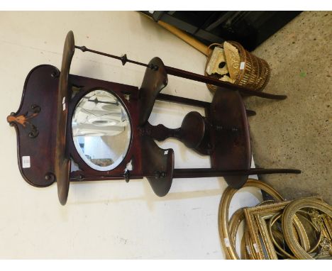 EDWARDIAN MAHOGANY SHAPED SHELF UNIT WITH TURNED SPINDLE SUPPORTS WITH CENTRAL OVAL MIRROR 