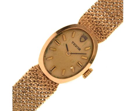 Tudor - 1970s lady's 9ct gold bracelet watch, the oval champagne dial with applied gilt baton hour markers, signed 17 rubies 