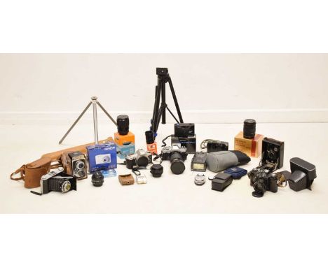 Quantity of various cameras, to include Canon, Moinolta, Olympus, and photographic equipment, tripods, etc