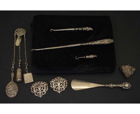 Edward VII silver chatelaine, with three chains supporting miniature hand mirror, stamp case and a small cylindrical pot, tog