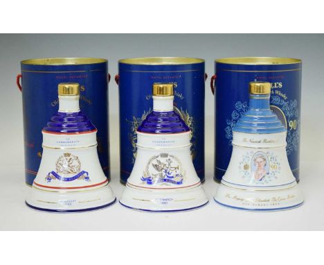 Three Bell's Scotch Whisky commemorative decanters by Wade, and one 50cl decanter commemorating the birth of Prince William o